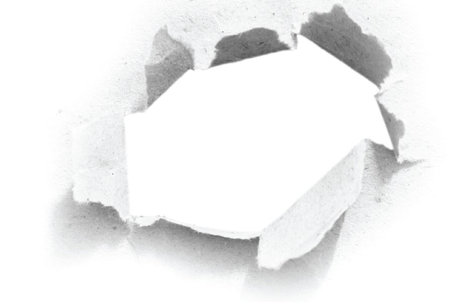 An abstract image of a paper surface with a torn hole in the center, revealing a clean, white background. The edges of the torn paper are jagged and textured, emphasizing the raw, ripped effect. The image creates a sense of unveiling or breakthrough, symbolizing discovery or creative expression.