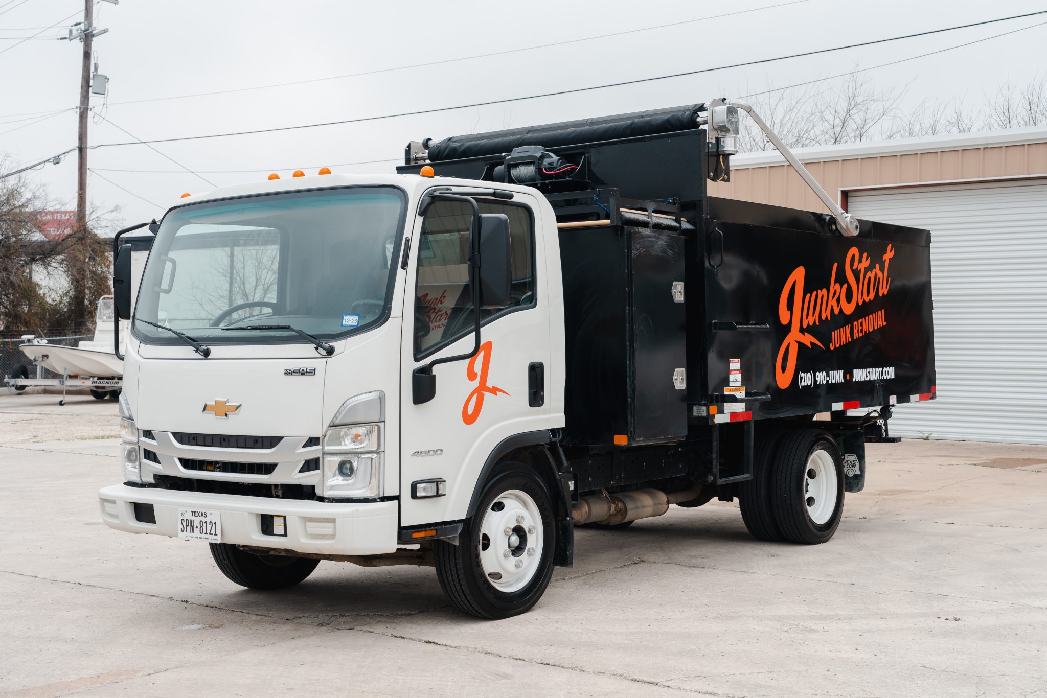 JunkStart Junk Removal truck parked outside the company’s San Antonio headquarters.