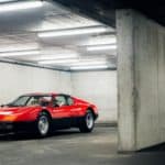 A car parked on the side of a building