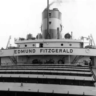 fitz A historic black and white image of the Edmund Fitzgerald vessel, showcasing its prominent name and iconic structure, located at The History Museum's maritime exhibit.