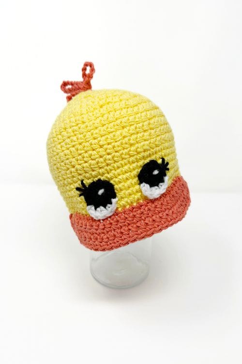 yellow and orange crochet duck cap with big eyes