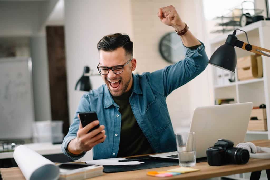xcited marketing professional celebrating campaign success after maximizing MDF and Co-Op ROI.