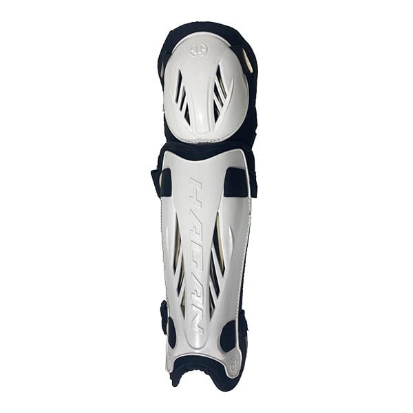 The H-5 Hagan Hockey Shin Guards SENIOR are black and white shin guards with protective padding and adjustable straps, designed for player safety.