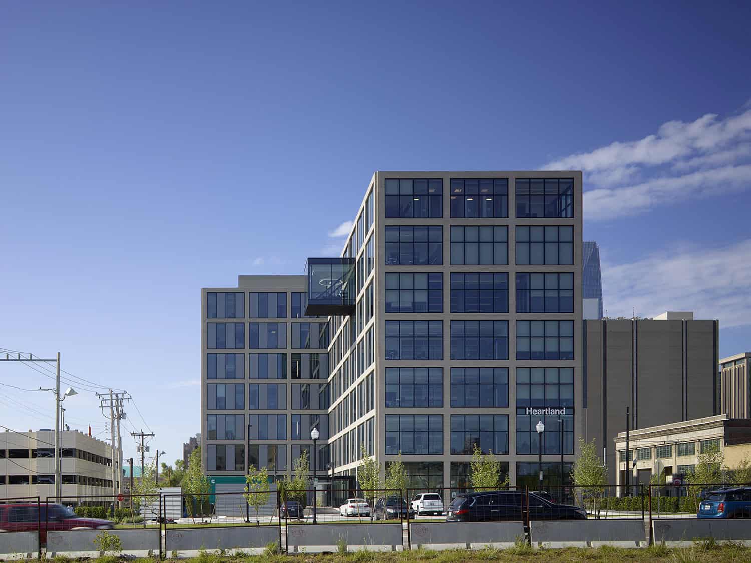 Side view of Heartland Headquarters in Oklahoma City, showcasing the cantilevered glass room and modern facade.