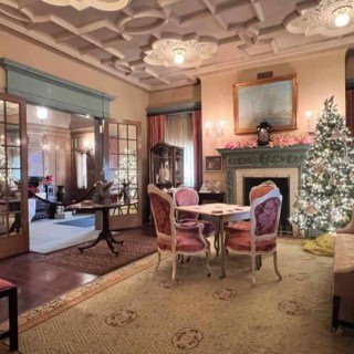 Morning Room by Skylar Whited Elegant Victorian-style living room with Christmas tree at The History Museum.