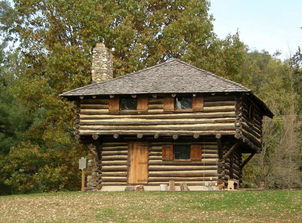 Fort_Ouiatenon_blockhouse_front Log cabin historical museum exhibit showcasing early American frontier architecture and cultural history.