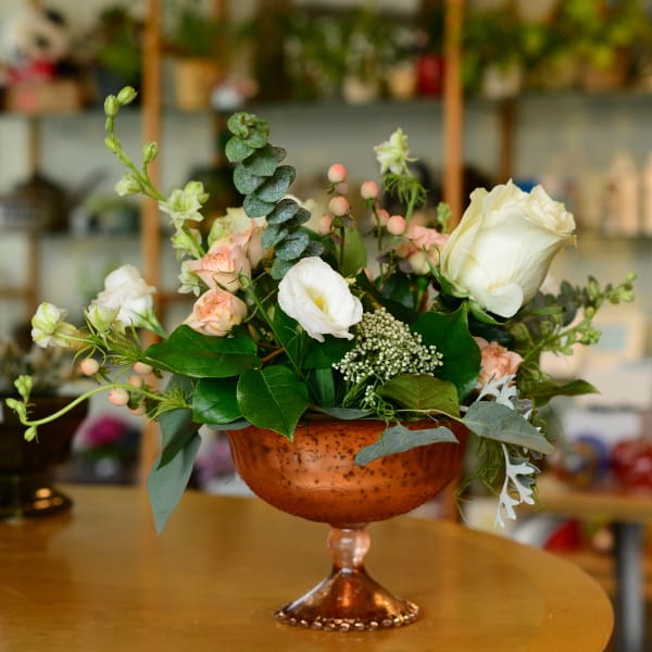 Flower arrngement in copper dish