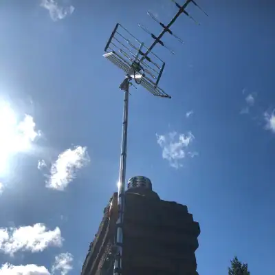 chimney installation by digital tv systems A tv aerial installation on a chimney
