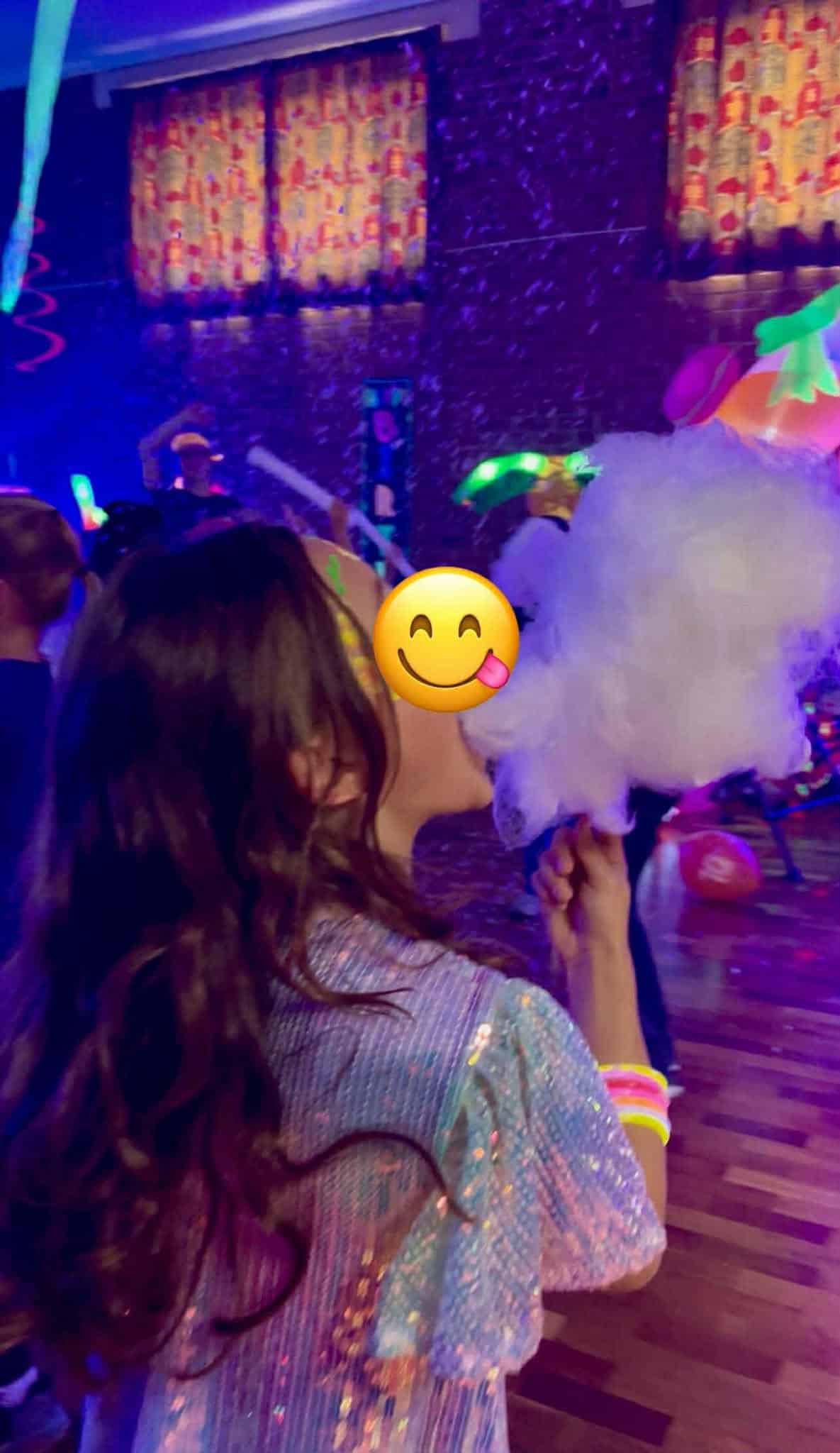 Candy floss hire for birthday parties Surrey Hampshire Berkshire - Childrens Party Entertainers | Surrey Hampshire and Berkshire | Treasure Box Parties A smiling child enjoying freshly made candy floss at a children’s party in Camberley. A sweet and colourful moment that shows how our candy floss machine adds excitement and joy to birthdays across Farnborough, Fleet, Aldershot, Bracknell and surrounding areas in North Hampshire, West Surrey and South Berkshire.