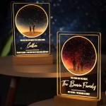 The Custom Night Sky Night Light features two illuminated acrylic plaques on wooden bases, displaying a starry sky and two silhouettes. Personalize each with names, messages, and dates to create a uniquely meaningful gift.