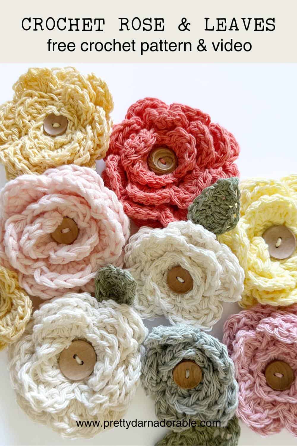 crochet roses in different colours with crochet leaves and buttons