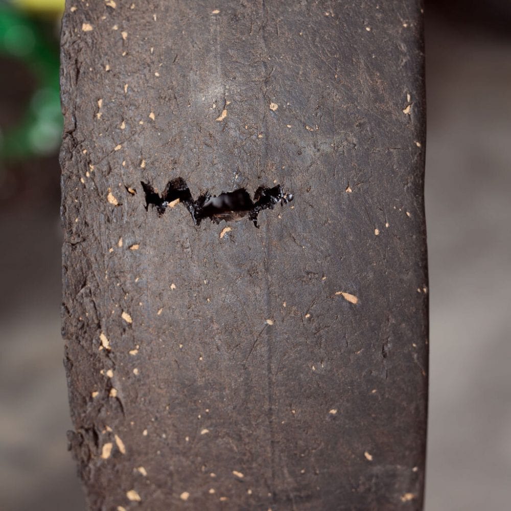 Close-up of a urethane tire showing signs of wear, cracks, and deterioration after prolonged use, highlighting reduced durability.