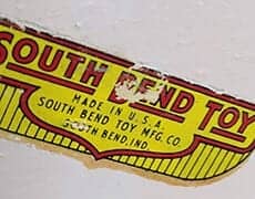 sbtoy Vintage South Bend Toy Co. label, antique toy branding, collectible toy memorabilia, historic toy packaging.