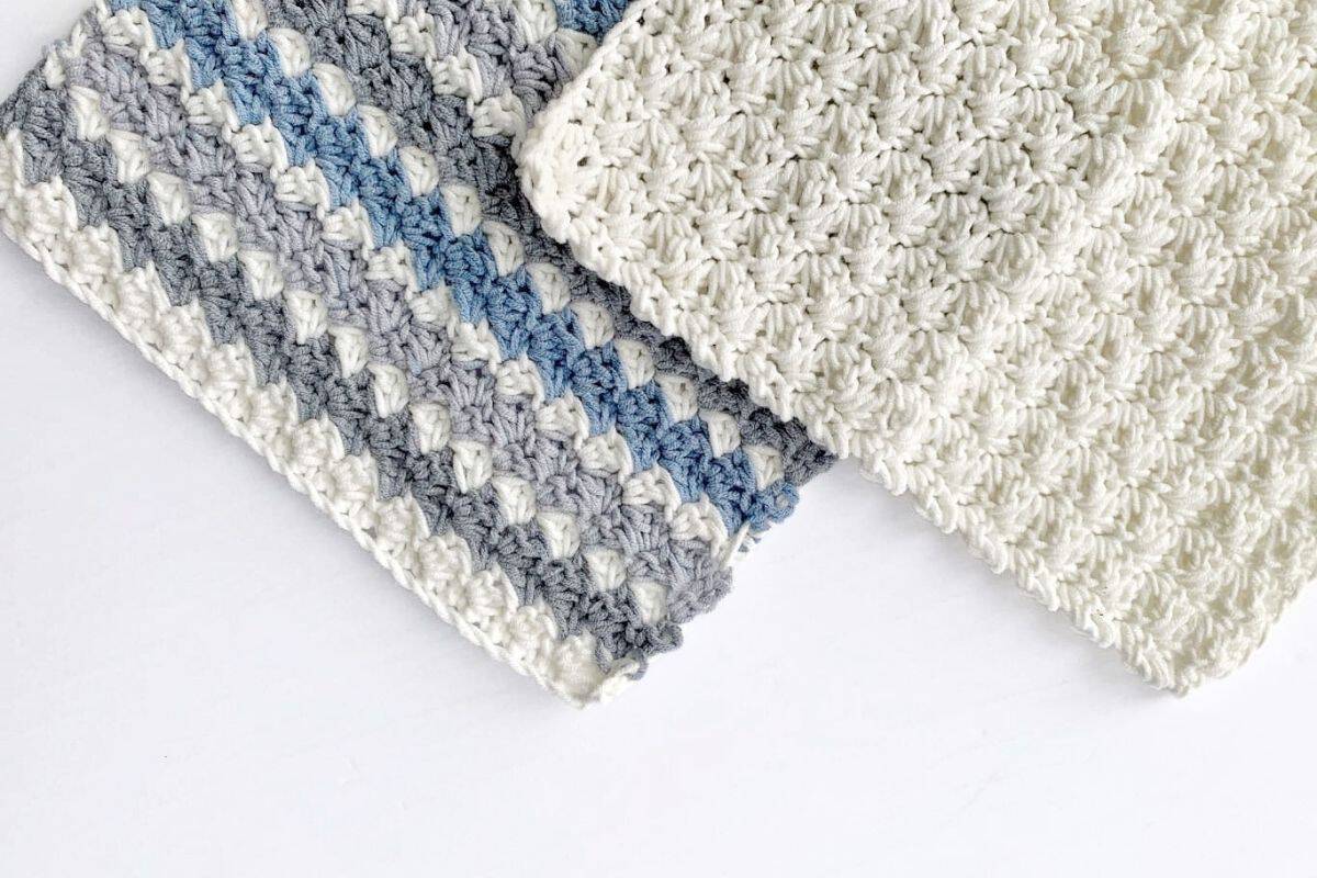 Two crocheted rectangles with puff stitch texture are shown side by side on a white surface; one is solid white, and the other has stripes in white, gray, and blue. No visible text or promotional information appears in the image. Free crochet pattern