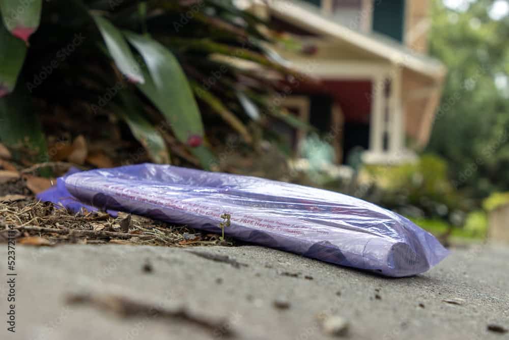 Newspaper on driveway