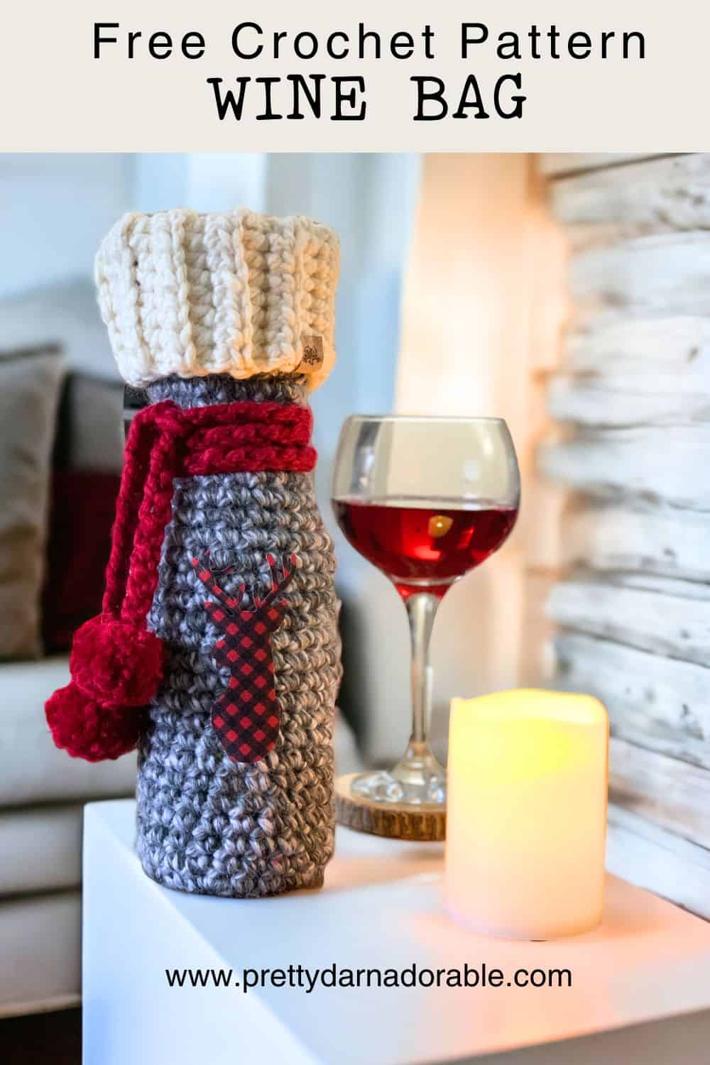 grey white and red crochet wine bag with applique