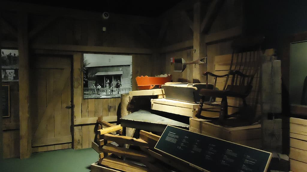UsingtheLand Wooden furniture and historical artifacts display at The History Museum.