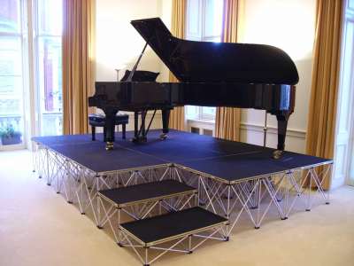 GrandPiano - NexGen Portable Staging & Dancefloors Staging with good weight loading is NexGen Portable staging, which can easily support a grand piano.