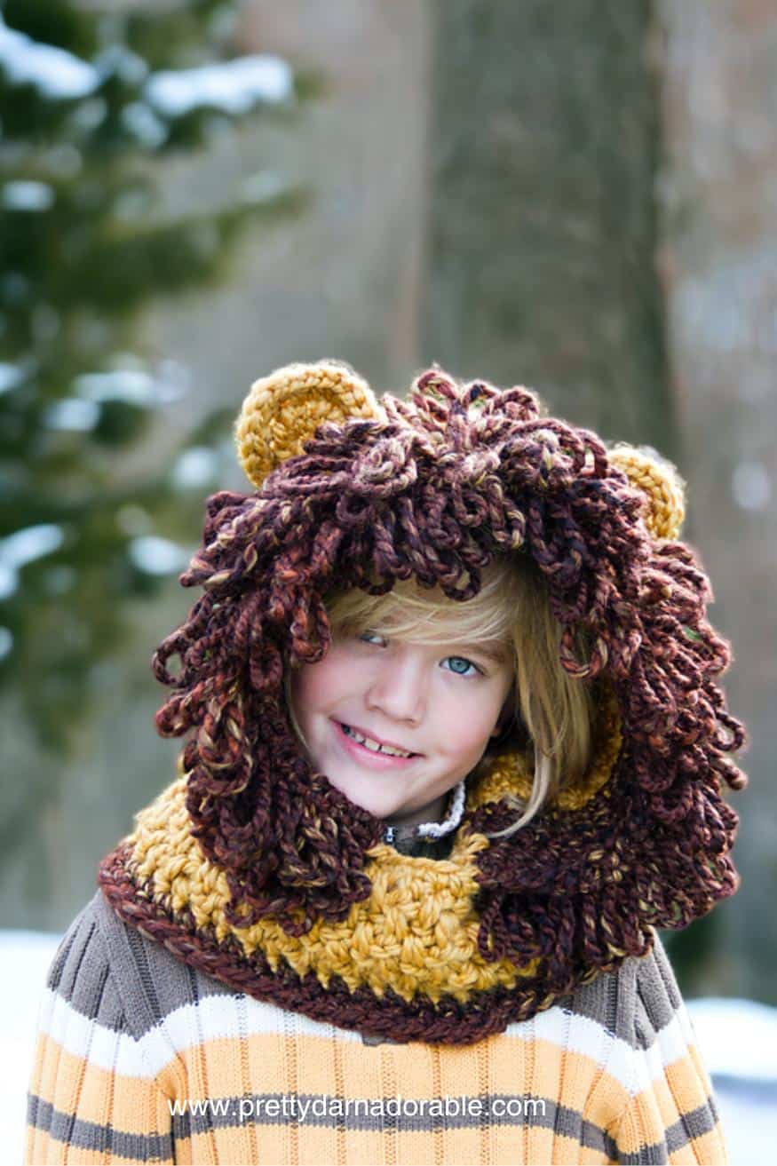 child wearing lion crochet hooded cowl