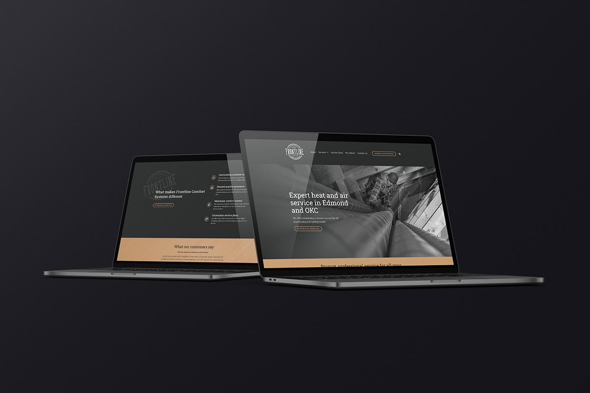 Two laptops display a modern website design created by a marketing agency.