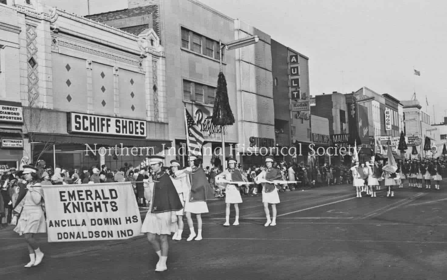 Thanksgiving Day parade 1969 ph9202 Old black and white parade scene with members of the Emerald Knights marching on city street.