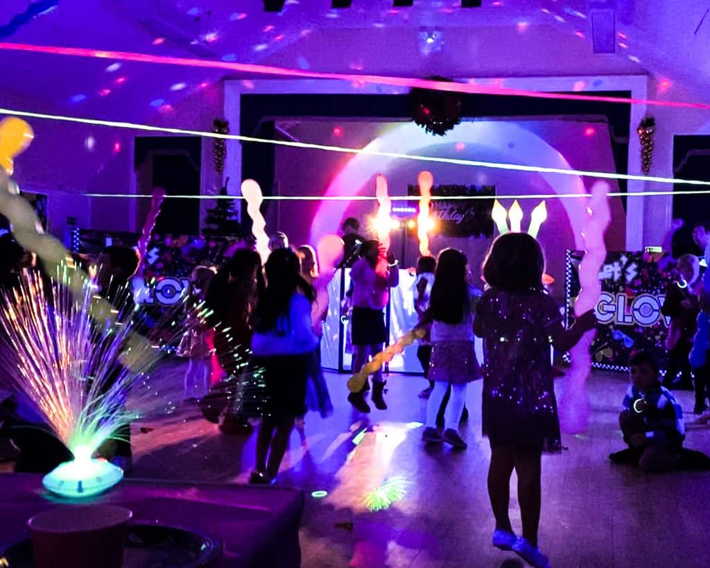 Glow UV Disco Birthday Party in Camberley | Treasure Box Parties - Childrens Party Entertainers | Surrey Hampshire and Berkshire | Treasure Box Parties A thrilling UV glow disco party in Camberley with blacklight effects, dancing, and glowing decorations.