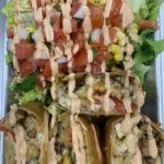 taco salad and burrito on a plate