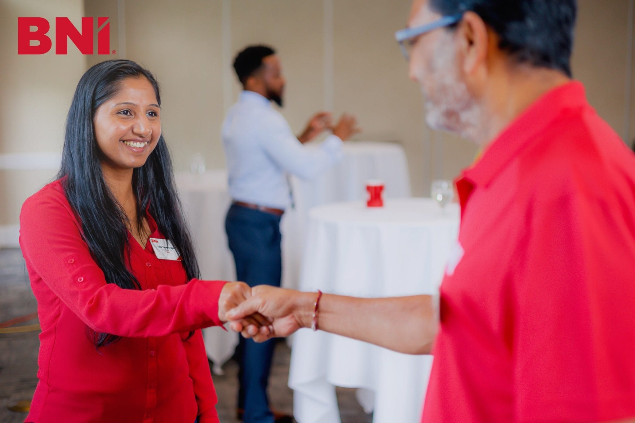 BNI members shaking hands and networking at a BNI chapter event