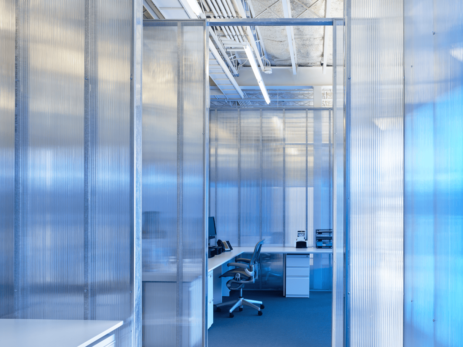 PLICO at the Flatiron interior hallway with translucent partitions