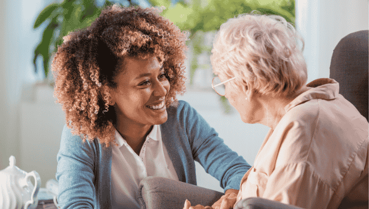 Companionship and Supportive Care for Seniors | Emotional and In-Home Support Services Caregiver providing companionship and supportive care to a senior in a warm, caring environment, ensuring emotional well-being.Caregiver providing companionship and supportive care to a senior in a warm, caring environment, ensuring emotional well-being.