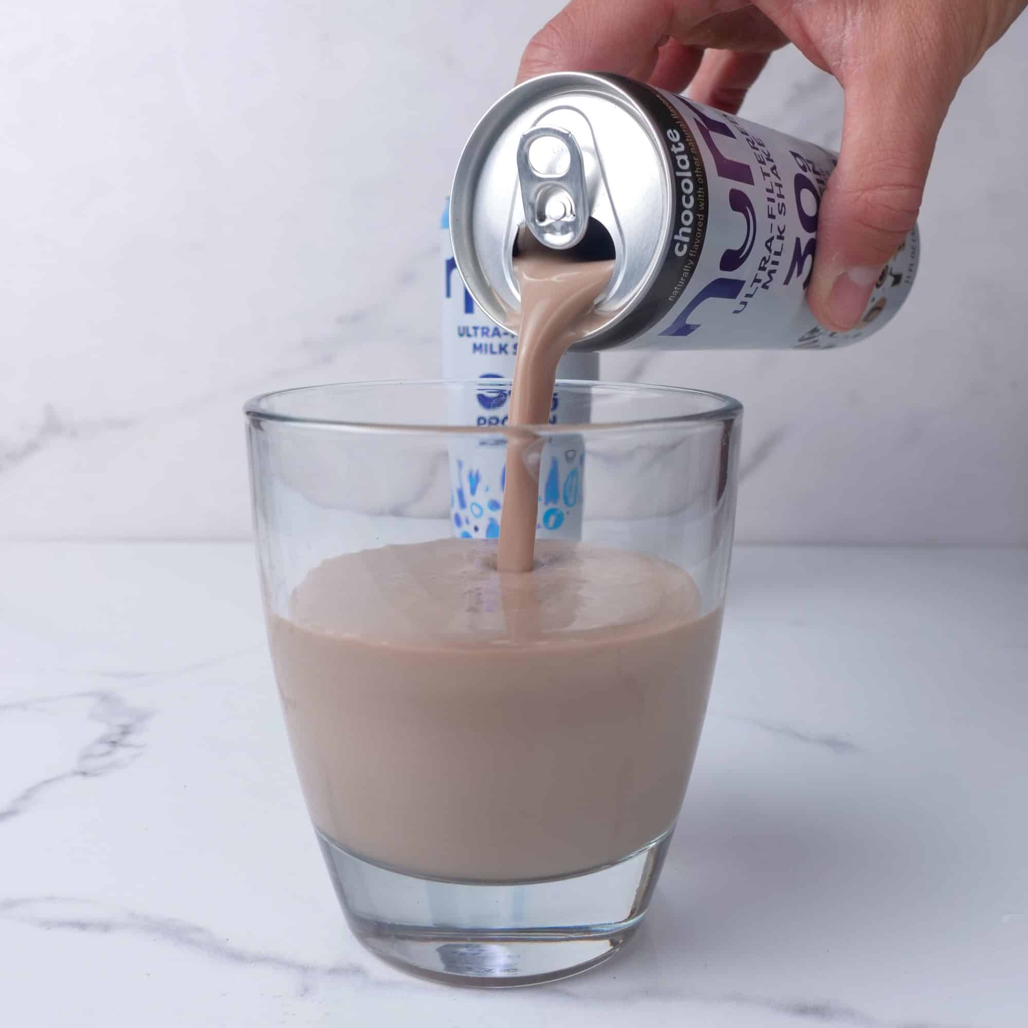 Pouring Nurri protein shake