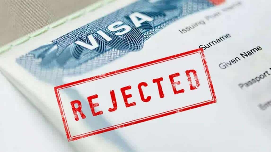 Graphic of student visa with rejected stamp referencing traffic violation cancellations