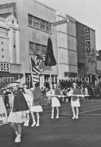 Thanksgiving Day parade 1969 ph9202 Old black and white parade scene with members of the Emerald Knights marching on city street.