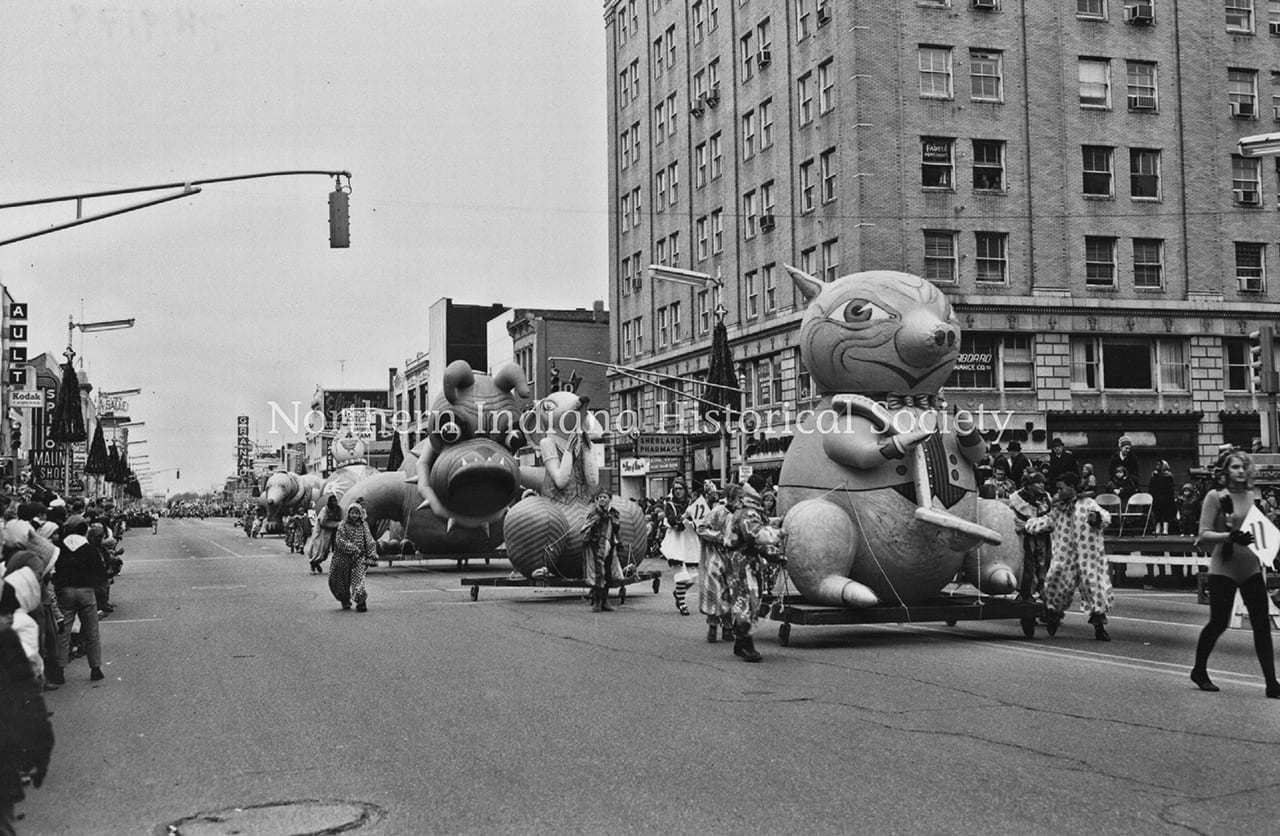 Thanksgiving Day parade 1967 ph 9179 (Kagel) (1) Colorful parade floats featuring cartoon characters on city street during celebration.