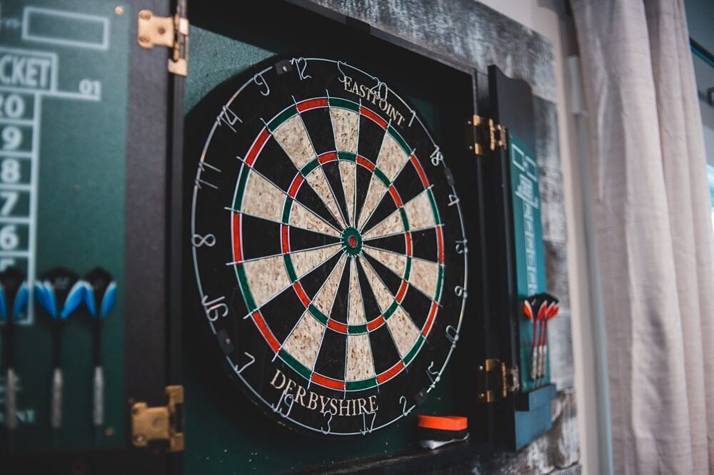 Dartboard hanging in a dart cabinet