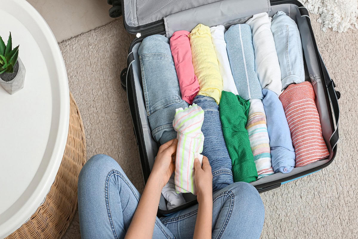 how to pack sweaters in a suitcase