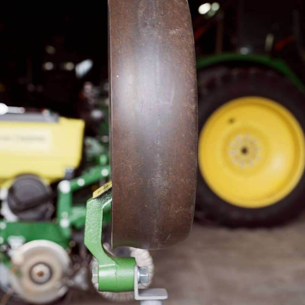 Close-up of the 4AG gauge wheel showcasing its durable design and high-quality composition, built for long-lasting performance in farming operations.