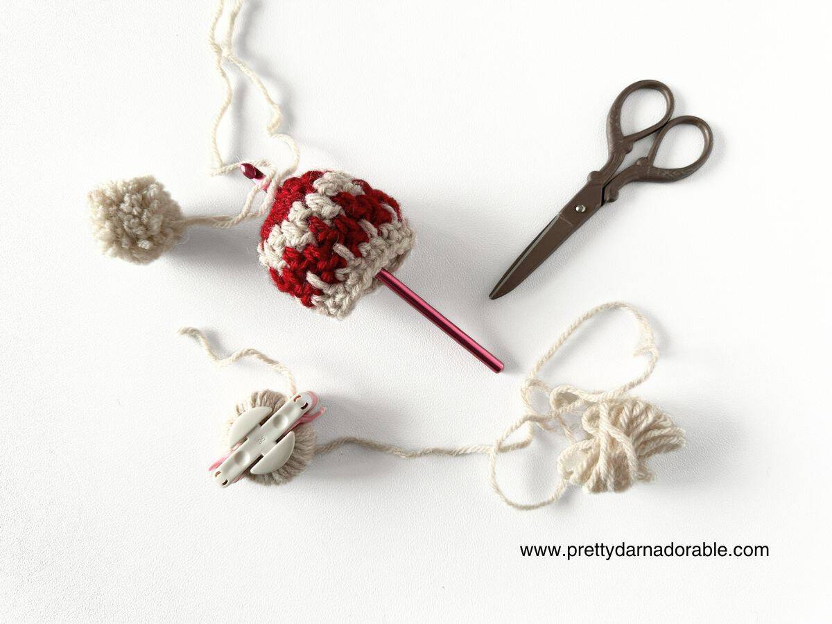 attaching pom pom to hat