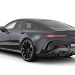 A close up of a car with Holden Arboretum in the background