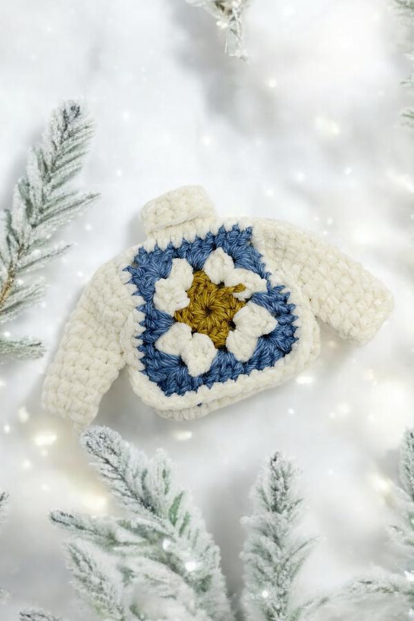 crochet granny square christmas tree ornament laying on a white background