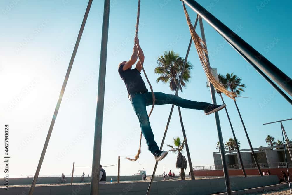 USA, California, Los Angeles, Venice, Man on the rope at Muscle Beach
