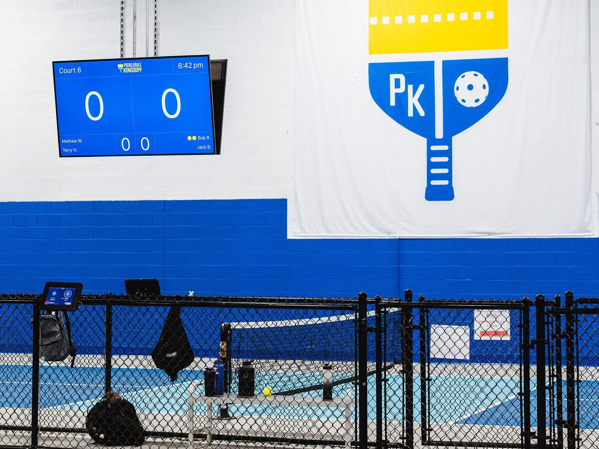 Image of pickleball court and score board for franchise technology article.