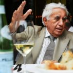 A man sitting at a table eating food