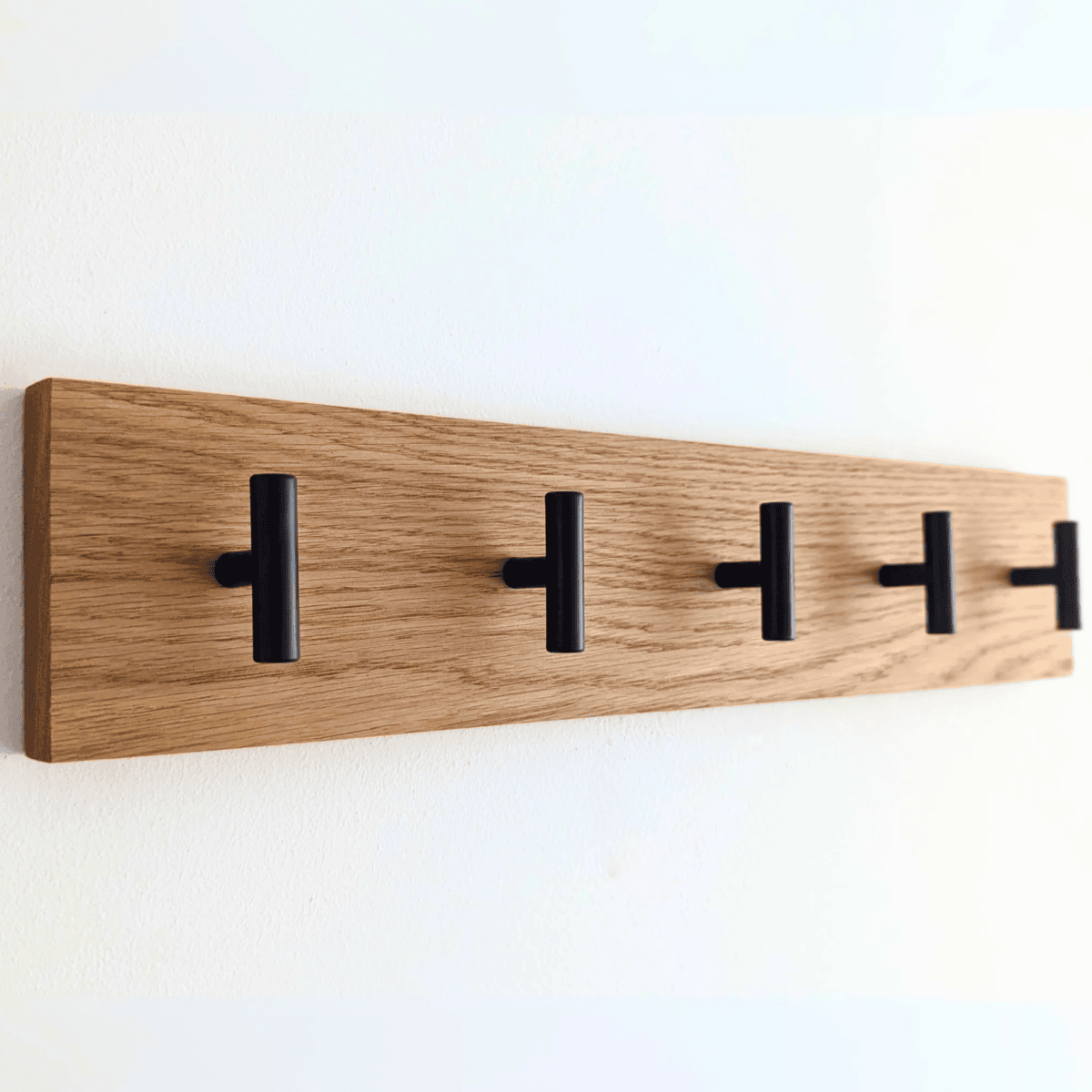 Modern Solid Oak Coat Rack with black Hooks - Angled view