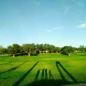 500px Photo ID: 173009117 - A park with shadows casted by us on the grass.