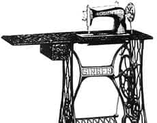 115-1 Antique vintage sewing machine on ornate metal stand, historical textile tool display.