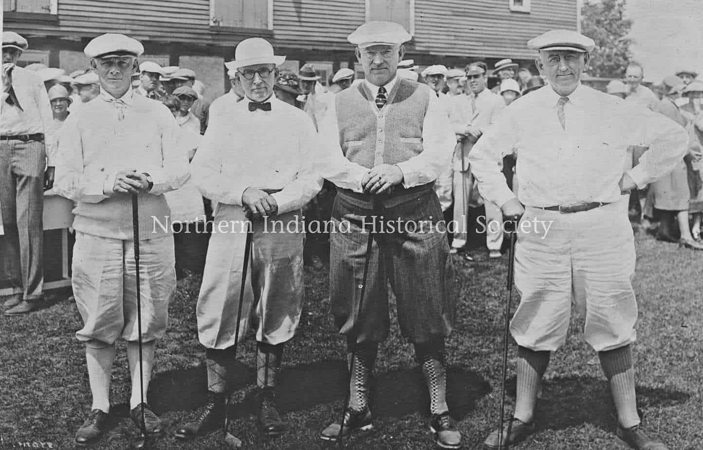 Erskine Golf Course golfers ph5444 Men dressed in early 20th-century golf attire holding clubs at a golf event.