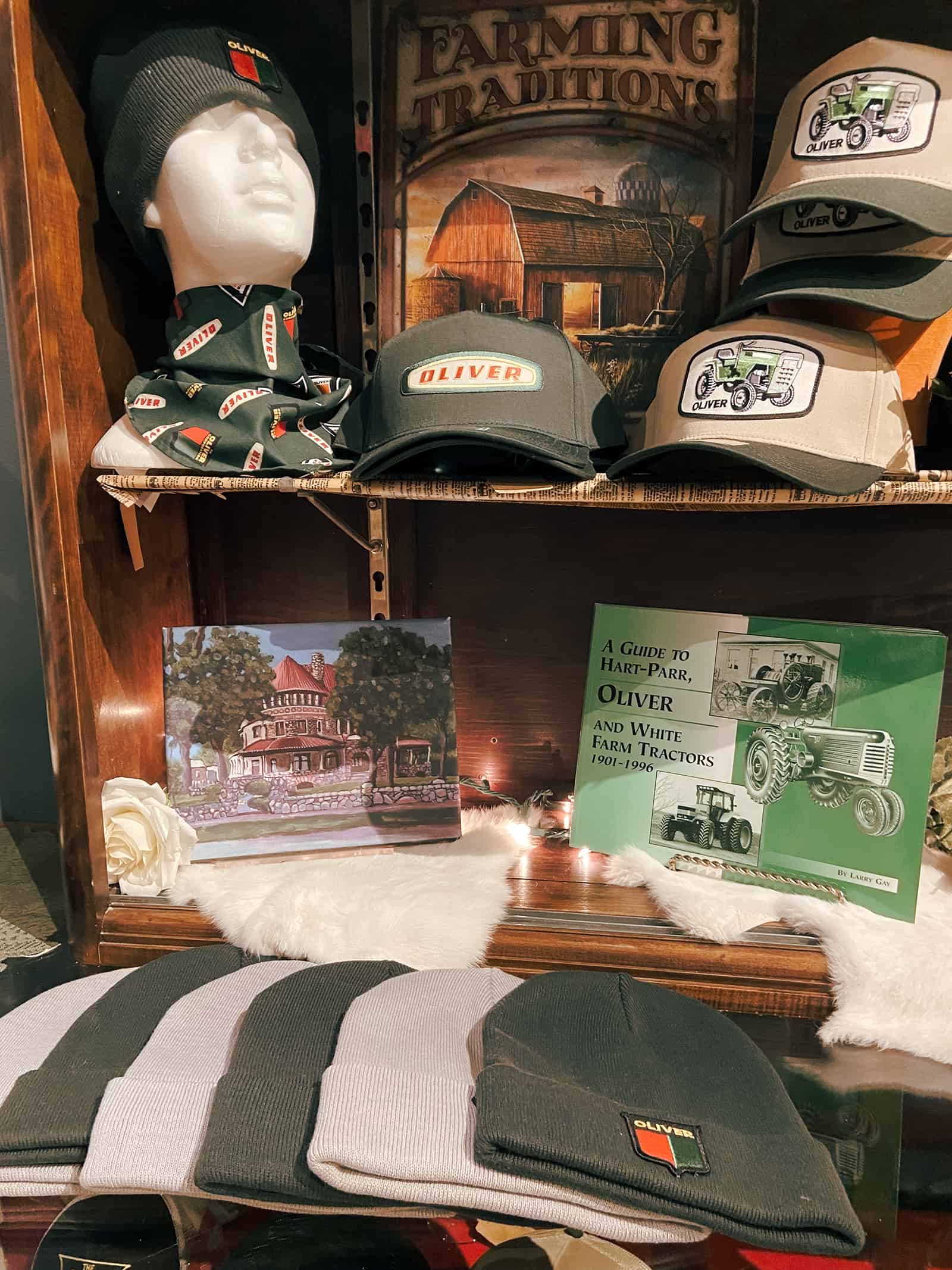 IMG_2645 Beanie hat with "OLIVER" logo and tractor-themed baseball caps at The History Museum.