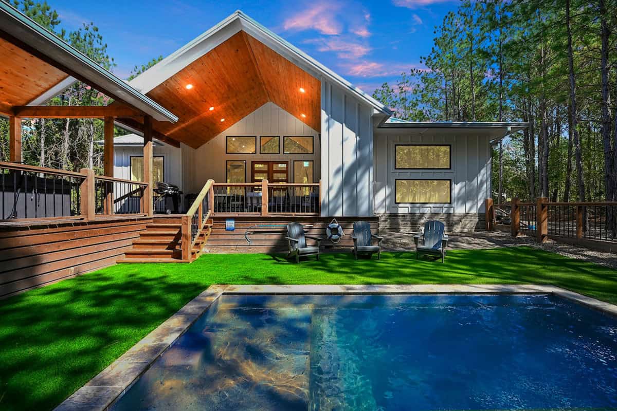 Splish splash luxury cabin in broken bow with private pool and outdoor seating.