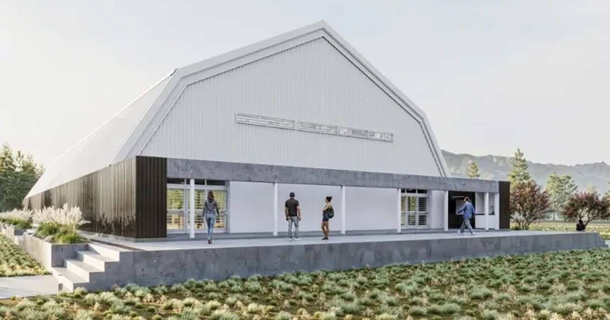 Vista del proyecto del Centro Deportivo Comunitario de El Chañar, con salón cubierto y playones exteriores